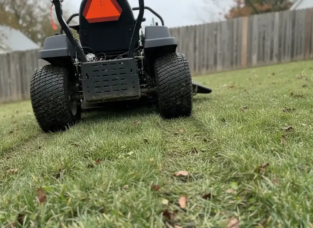 Aggressive tread tires on lawn hill